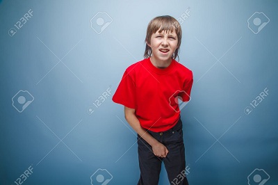 38029287-teenager-boy-in-red-T-shirt-European-appearance-brown-hair-holds-his-hand-over-the-lower-abdomen-wri-Stock-Photo.jpg